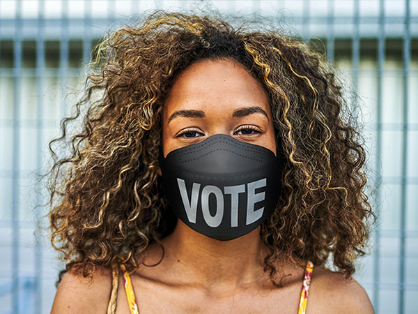 woman wearing vote face mask