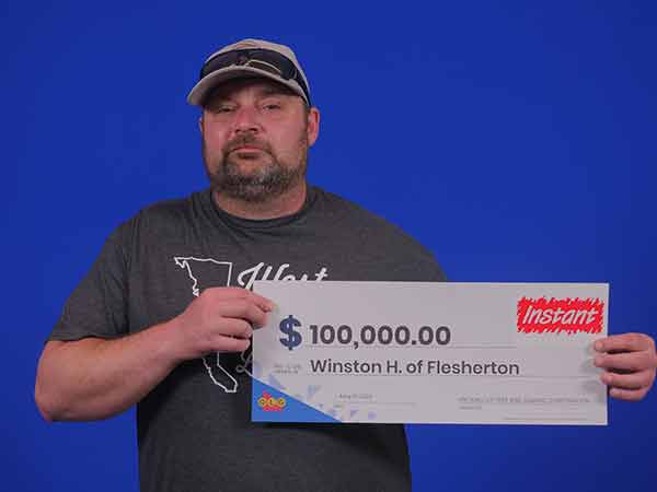 Jarrett Hawkins holds $100,000 big cheque