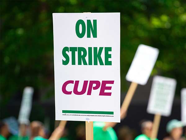 CUPE on strike protest sign