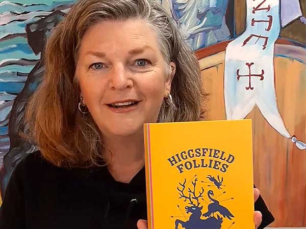 Jenny Parsons holds her book Higgsfield Follies