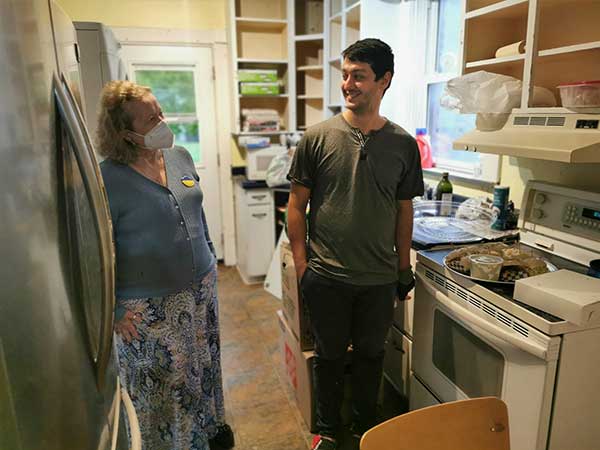 Ukrainian newcomer Siavash M. and Grey County Cares Chairperson Lynn Silverton during renovations to the Rural Net House