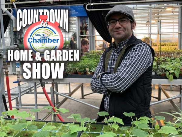 Paul Zammit standing in greenhouse.