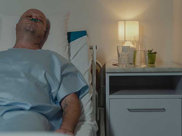 palliative care patient in bed.