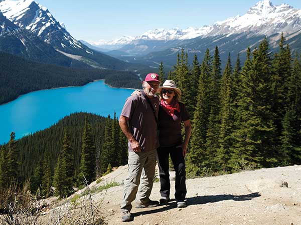 Max Finkelstein and Connie Downes pose with mountainous background