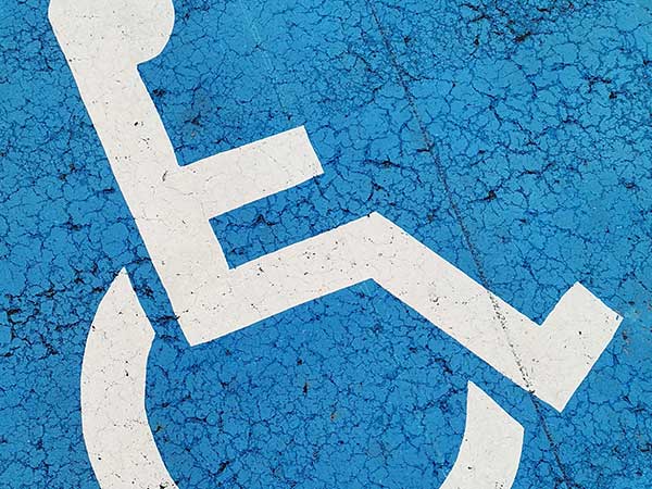 Wheelchair icon painted on a road