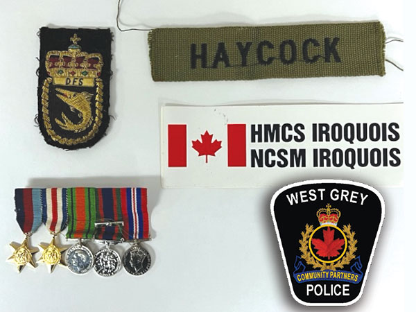 West Grey Police logo and an array of military metals and badges