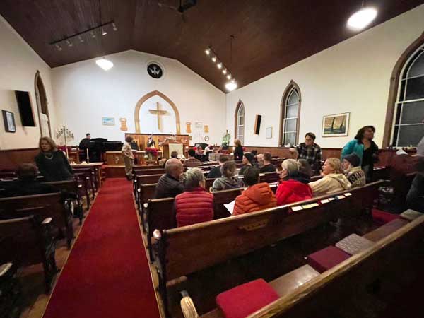 Highland United Church interior with audience for Cookies and Carols event