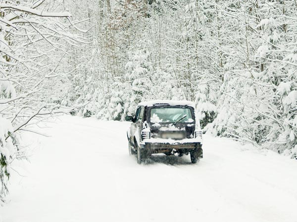 Car driving on a snowy road