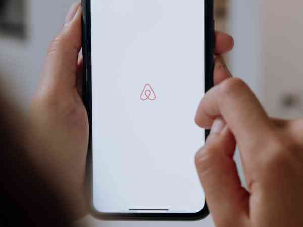 AirBnB logo on a mobile phone screen