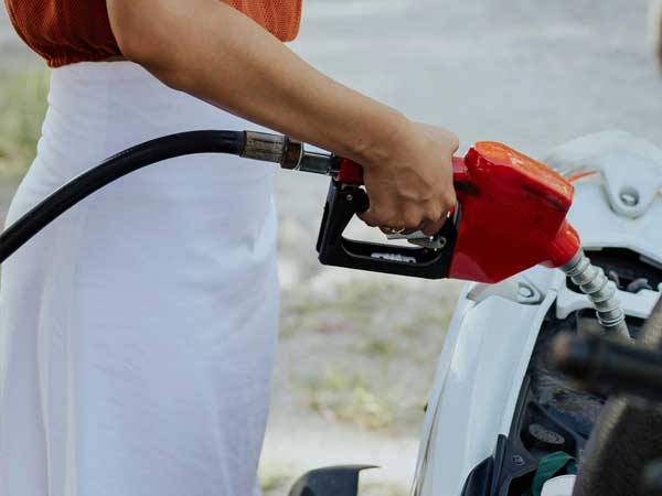 Person pumping gas into their car