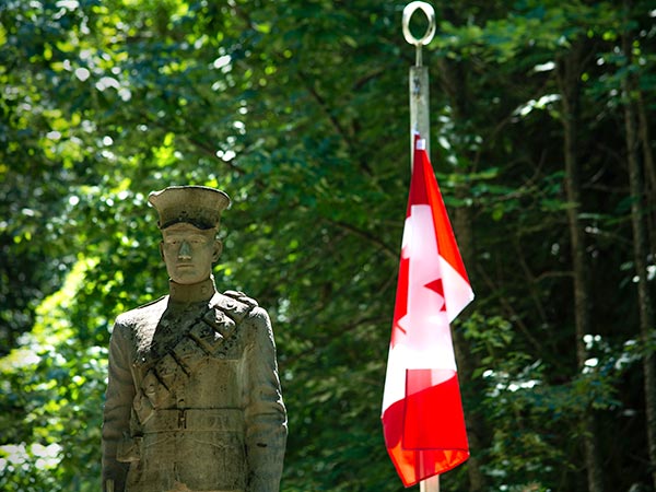 Soldier statue and flag at Eugenia Falls Conservation