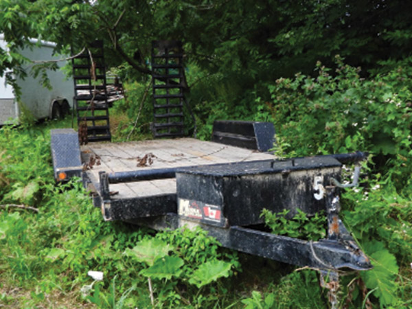 long trailer in vegetation