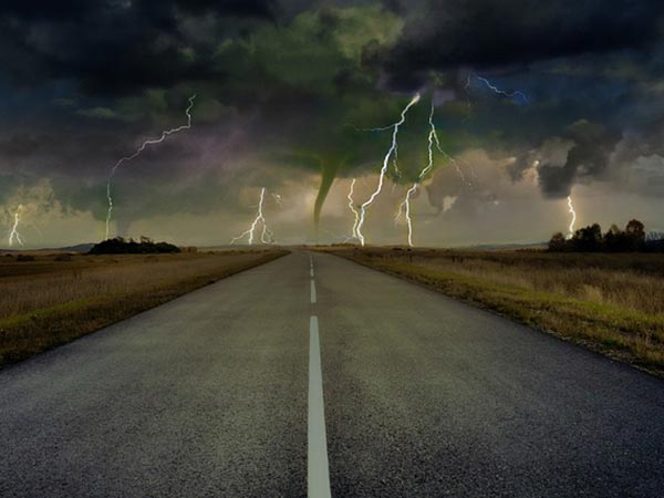 Highway, lightning and tornado in distance.