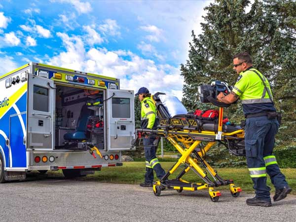 Grey County Paramedics loading stretcher into truck