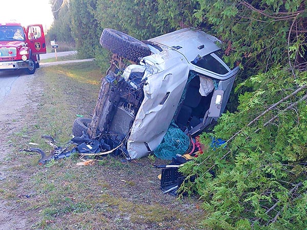 White pickup truck on side.