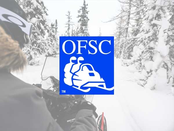 OFSC logo with picture of snowmobile on a trail