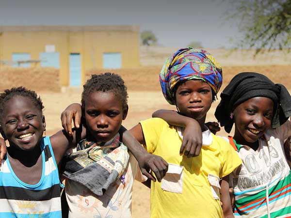 four black girls with arms locked