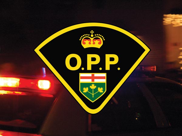 OPP logo with lights at night.