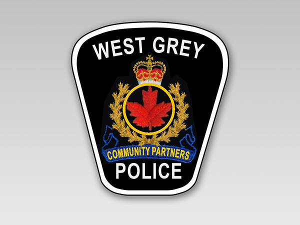 West Grey Police badge on plain background.