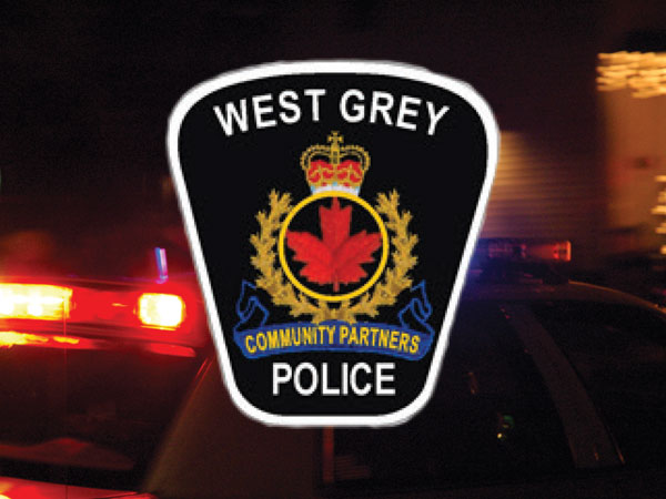 West Grey Police logo and emergency lights.