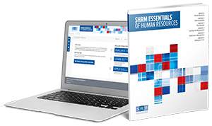 SHRM Essentials on a laptop and book