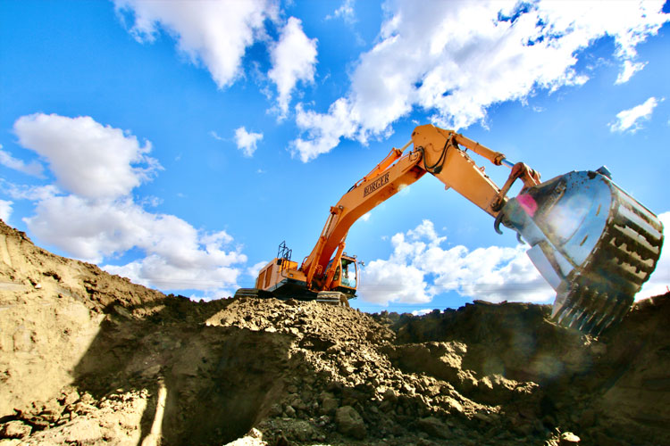 heavy civil construction safety with an excavator doing trench work