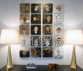 A grid arrangement of contemporary artwork by Mark Westervelt between luxury lamps by AERIN 