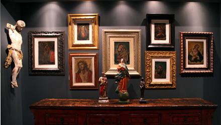 An assemblage of rare Christian art above a Chinese laquered cabinet
