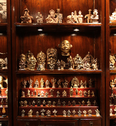 Miniature bronzes and other curios are interesting to explore when displayed in intriguing ways