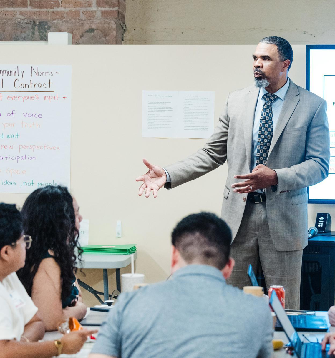 Dr. Allen addressing students in a college classroom