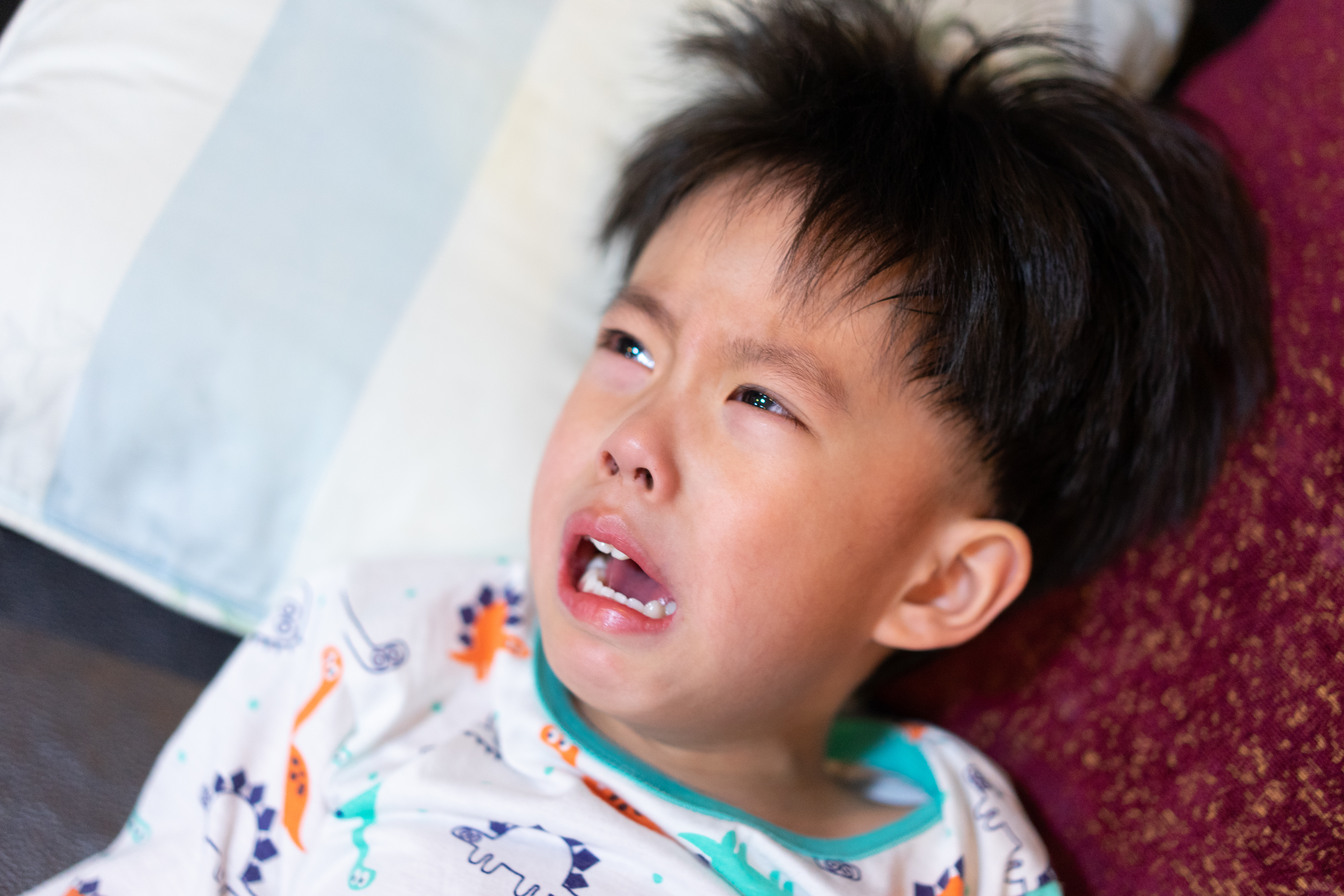 child throwing tantrum on floor