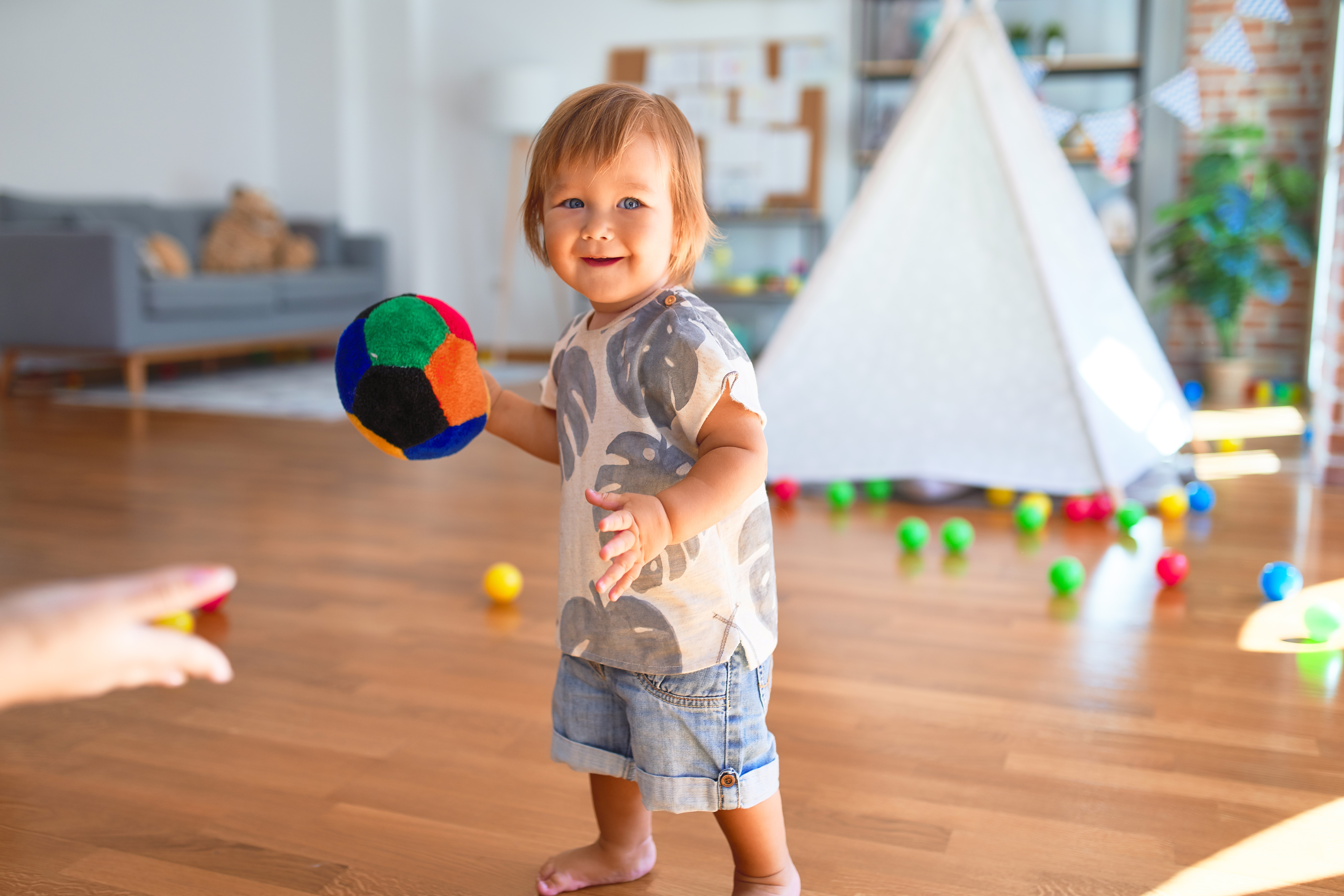 Toddler Testing Limits: Hits and Throws Toys